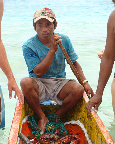 A fisherman pops up at one of the San Blas Islands