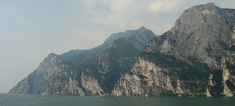 Looking back to the sheer cliffs walls of Lake Garda with the cycling path
